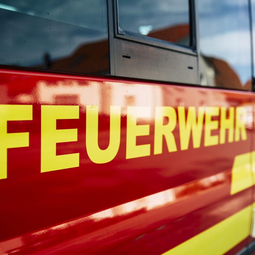 German Firefighter with a red Firetruck